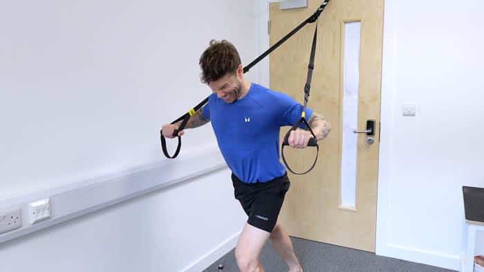 Building strength with a TRX suspension trainer by pushing