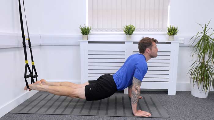 TRX Core exercise knee tucks